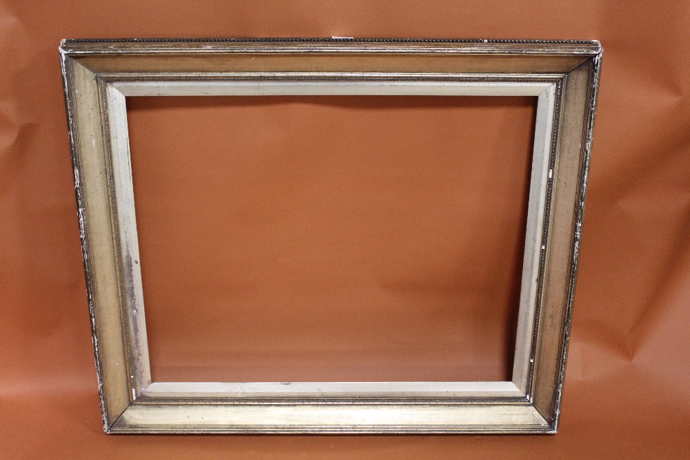 A 19TH CENTURY GILT PICTURE FRAME WITH GOLD SLIP - SLIP REBATE 77CM X 62CM FRAME REBATE - 83CM X