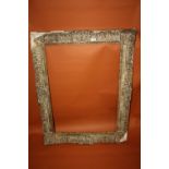 A 19TH CENTURY SWEPT GILT PICTURE FRAME - REBATE 86 X 63 CM