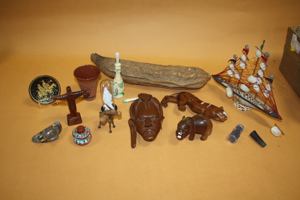 A BOX OF COLLECTABLES TO INCLUDE A MODEL SHELL BOAT, NATIVE SEED POD, CARVED AFRICAN ANIMALS