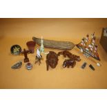 A BOX OF COLLECTABLES TO INCLUDE A MODEL SHELL BOAT, NATIVE SEED POD, CARVED AFRICAN ANIMALS