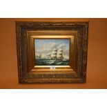B MURRAY - AN OIL ON BOARD DEPICTING SAIL SHIPS AT SEA SIGNED LOWER LEFT IN DEEP EDGED GILT FRAME