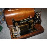 A CASED VINTAGE SINGER SEWING MACHINE