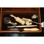 A SMALL BOX OF CARVED BONE COLLECTABLES ETC.