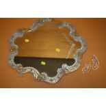 A VASELINE GLASS STYLE FRAMED WALL MIRROR WITH ETCHED DETAIL A/F