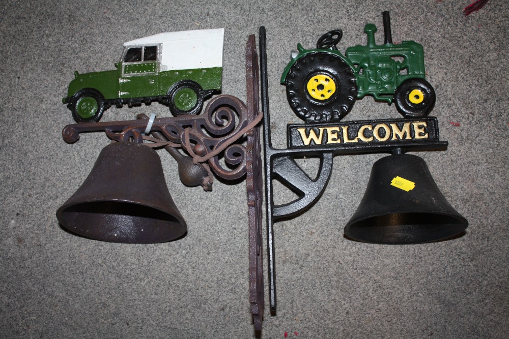 TWO MODERN CAST METAL WALL HANGING BELLS IN THE FORM OF A LANDROVER AND A TRACTOR