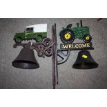 TWO MODERN CAST METAL WALL HANGING BELLS IN THE FORM OF A LANDROVER AND A TRACTOR