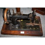 AN ANTIQUE INLAID SEWING MACHINE BY FRISTER & ROSSMANN