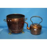 A COPPER COAL BUCKET WITH LION PAW FEET TOGETHER WITH A COPPER KETTLE