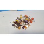 A SMALL BAG OF LOOSE SEMI PRECIOUS STONES ETC.