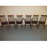 A SET OF SIX ERCOL DINING CHAIRS TO INCLUDE TWO CARVERS, ERCOL GOLDSMITH HIGH BACK DINING CHAIRS