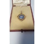 A DIAMOND PEARL AND GUILLOCHE ENAMEL PIERCED PENDANT, the central panel being light blue enamel