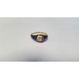 AN ENAMELLED DIAMOND SOLITAIRE RING, in unmarked metal, the diamond is an estimated half a carat