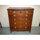 A TWO OVER FOUR MAHOGANY CHEST OF DRAWERS, LEG IS DETACHED BUT PRESENT (HAS HAD WORM)