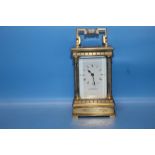 A SMALL BRASS CARRIAGE CLOCK MARKED TO THE FRONT "J. J. RUDELL, WOLVERHAMPTON", WITH KEY¦Condition