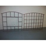 TWO CAST IRON ARCHED WINDOW FRAMES A/F WITH CRACKS AND BREAKS, ONE HEIGHT 110 CM WIDTH 106 CM, THE