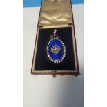 A VICTORIAN DIAMOND AND GUILLOCHE ENAMEL PENDANT, of oval form and surrounded by 30 old cut diamonds