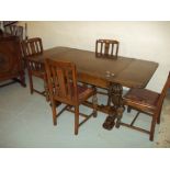 AN OAK DRAWER LEAF TABLE WITH FOUR CHAIRS, PINEAPPLE LEGS, EARLY 1900S¦Condition Report:GOOD