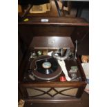 AN HMV RADIOGRAMME TOGETHER WITH A COLLECTION OF GRAMAPHONE RECORDS