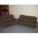 A LAYZBOY THREE SEATER STATIC AND A TWO SEATER MANUAL RECLINER TWO PIECE SUITE