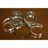 A BAG OF 10 SILVER CHRISTENING BANGLES - APPROX 30 g