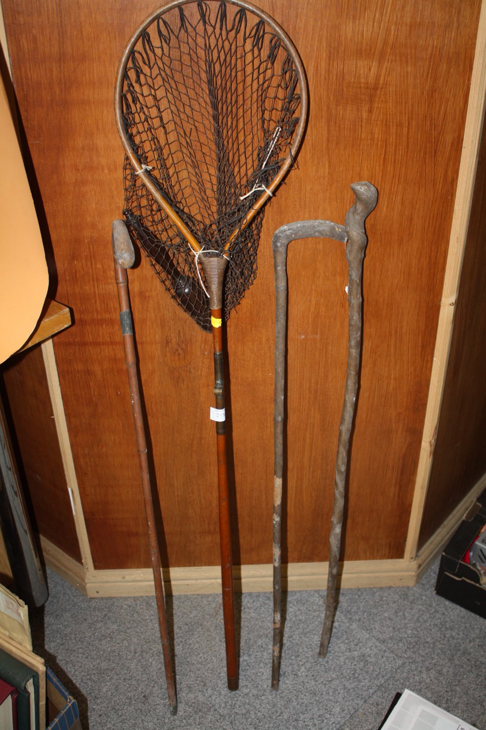 THREE VINTAGE WALKING STICKS, TOGETHER WITH A VINTAGE FISHING NET