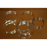 A BAG OF 8 SILVER BANGLES - APPROX 40 g