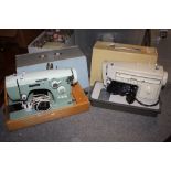 TWO CASED SEWING MACHINES TO INCLUDE A SINGER AND PINNOCK