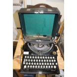 A VINTAGE CASED IMPERIAL TYPEWRITER