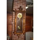 A LARGE VIENNA WALNUT WALLCLOCK WITH HORSE SURMOUNT H -130 CM