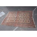 A LARGE WOOLLEN 20TH CENTURY RUG