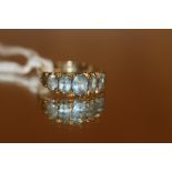 A 9CT FIVE STONE RING - WEIGHT 3.88 GRAMS APPROX