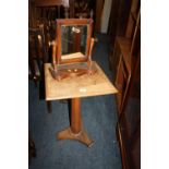 AN ANTIQUE OAK PEDESTAL TABLE AND A SMALL TOILET MIRROR (2)