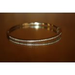 AN 18CT DIAMOND SET BANGLE - APPROX 15 g