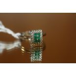 A 9CT GOLD EMERALD AND DIAMOND RING - WEIGHT 3.28 GRAMS APPROX