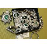 A BOX OF POLICE RELATED COLLECTABLES TO INC HANDCUFFS