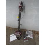 A SHARK ROCKET TRUE PET VACUUM CLEANER WITH VARIOUS TOOLS