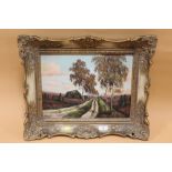 A GILT FRAMED OIL ON BOARD DEPICTING A COUNTRY ROAD SIGNED F WENTEL - OVERALL SIZE 55CM X 45CM