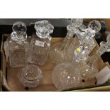 SIX CUT GLASS DECANTERS TOGETHER WITH A HALLMARKED SILVER RIMMED VASE