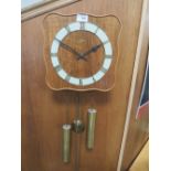 A VINTAGE RETRO STYLE JUNGHANS WALL CLOCK WITH TWO WEIGHTS AND PENDULUM