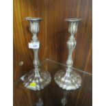 A PAIR OF LARGE WHITE METAL CANDLESTICKS WITH CONTINENTAL STYLE STAMP TO LOWER EDGE