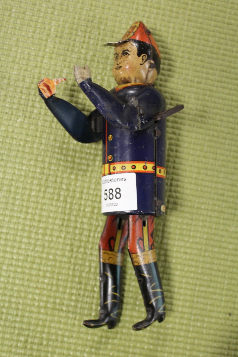 A VINTAGE TIN PLATE WIND-UP FIGURE - POSSIBLY A FIREMAN
