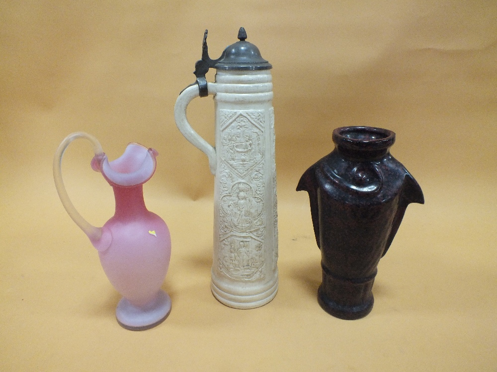 AN UNUSUAL STONEWARE VASE IN THE FORM OF A FISH, TOGETHER WITH A PINK GLASS JUG AND A TALL PEWTER