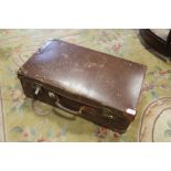 A VINTAGE LEATHER EFFECT SUITCASE