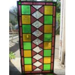 A VINTAGE STAINED GLASS WINDOW PANEL H 36 cm, L 72 cm
