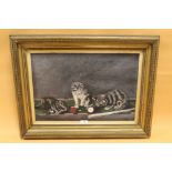 A GILT FRAMED OIL ON CANVAS DEPICTING A TRIO OF CATS UPON A SNOOKER TABLE - OVERALL SIZE 73 X 55.5