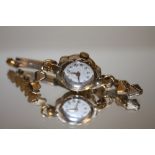 A 9CT GOLD CASED LADIES WRISTWATCH