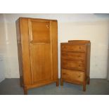 AN OAK TWO PIECE BEDROOM SET TO INCLUDE A WARDROBE AND A CHEST OF DRAWERS