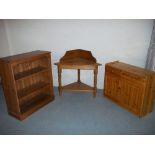 THREE ITEMS - A PINE STAND, A PINE BOOKSHELF AND A PINE UNIT