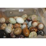 A COLLECTION OF APPROX. 59 STONE MARBLE GRANITE AND ALABASTER EGGS AND BALLS