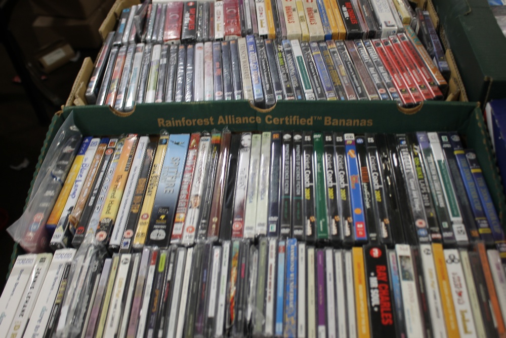 TWO TRAYS OF DVDS AND CDS